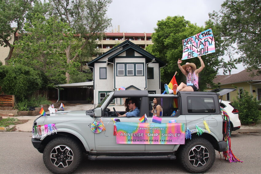 Edgewater Pride Parade Grand Marshal was Annelise "Ship" Shipley, seated on top of the car carrying a "Break the Binary, Be You" sign.